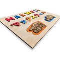 Children's name puzzle with dinosaurs and trucks, for bilingual families - The Charred Plank