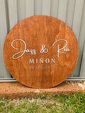 Circular wooden wedding sign with walnut stain and white MDF raised lettering